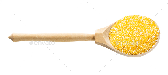 spoon with uncooked coarse maize cornmeal isolated