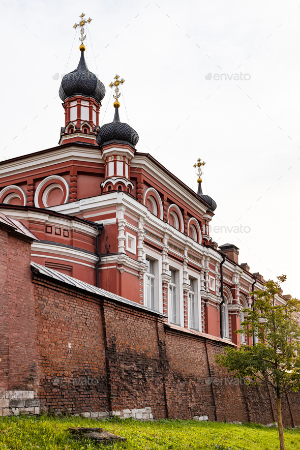 brick wall and church of Rozhdestvensky Convent - Stock Photo - Images