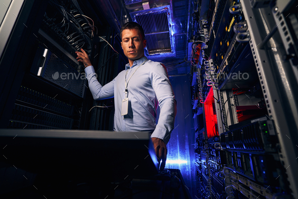 Data center engineer setting up network infrastructure