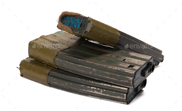 Several airsoft rifle magazines isolated on white background