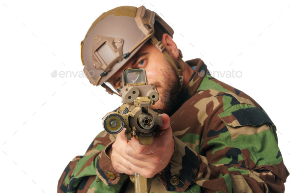 Airsoft player aiming with his rifle isolated on white - Stock Photo - Images