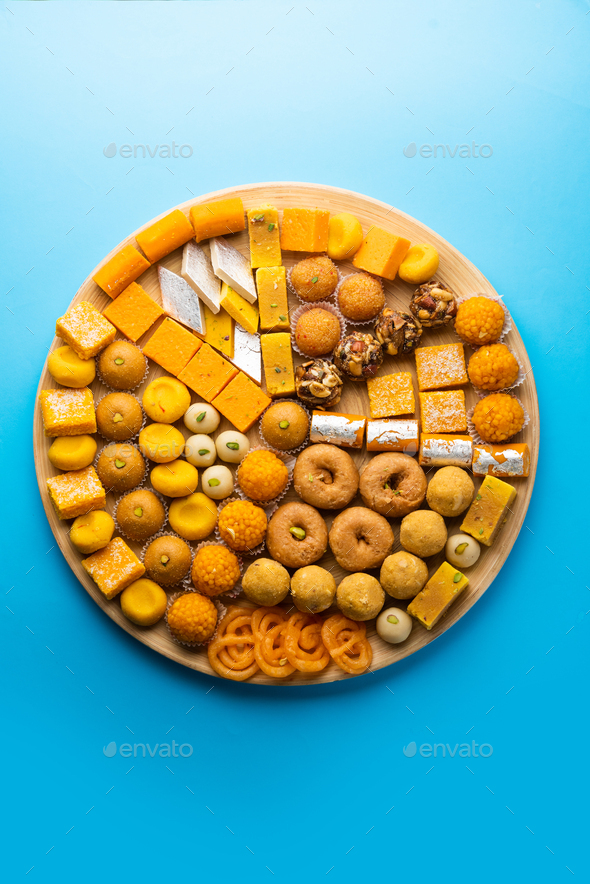 Group of Indian assorted sweets or mithai with diya Stock Photo by ...