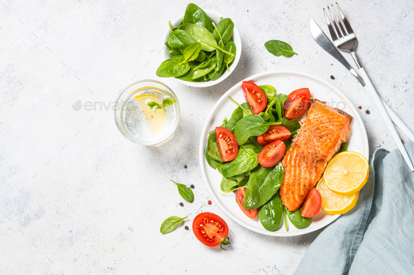 Salmon fillet with fresh salad. at white - Stock Photo - Images