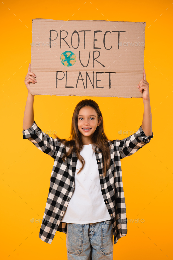 Eco-activist pupil holding a carton poster with save our planet logo for environment conservation