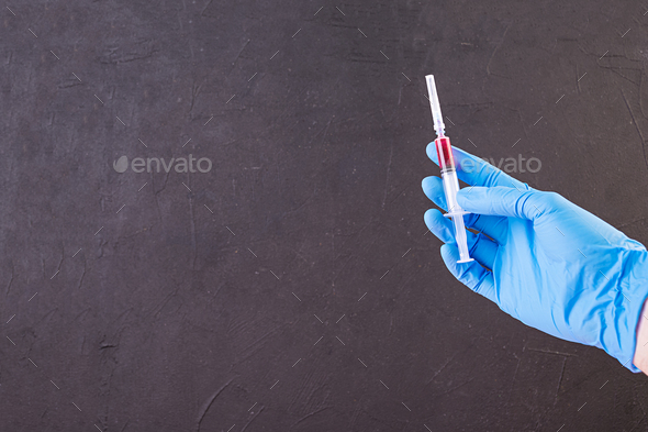 Viral disease protection. Disease and epidemic prevention. Syringe in hands