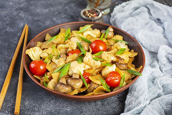 Stir Fry Farfalle Pasta With Vegetables, Cauliflower And Mushrooms ...