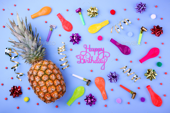 Happy birthday background. Festive pineapple, party confetti, balloons, streamers and decoration
