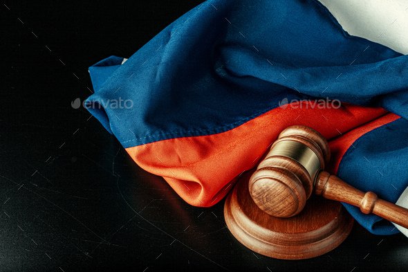 Russian justice. Wooden gavel and russian flag