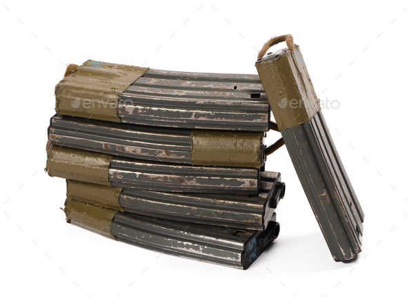 Several airsoft rifle magazines isolated on white background