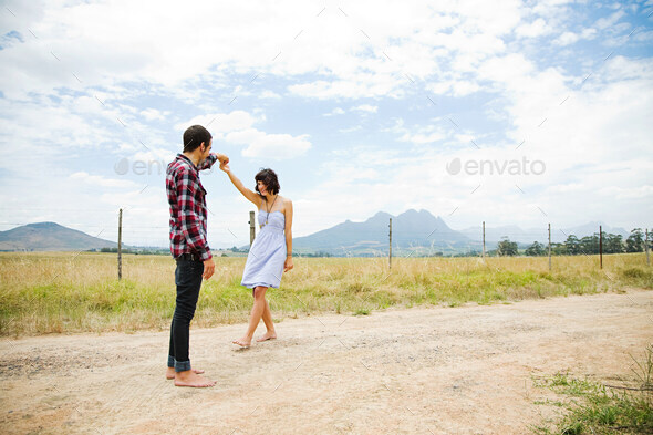 Young couple dancing in remote setting
