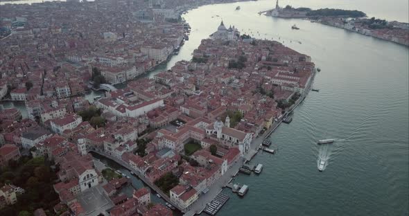 Aerial revealing shot Flying towards San Marco over Canal Grande at dusk, Venice, Italy alt