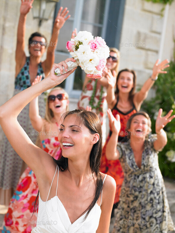 Bride throwing her bouquet Stock Photo by ImageSourceCur PhotoDune