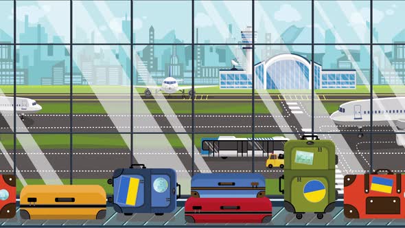 Suitcases with Ukrainian Flag Stickers in Airport alt