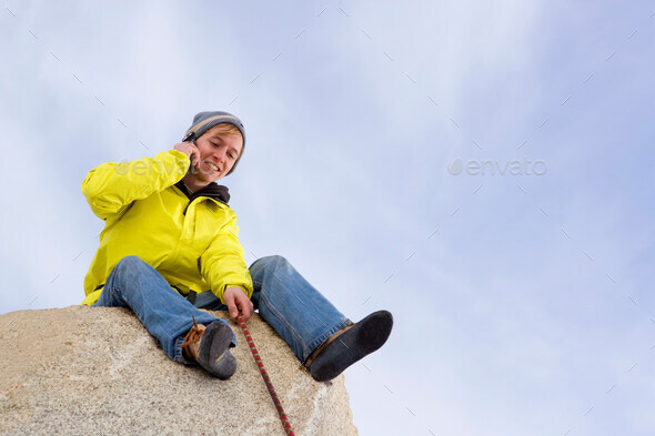 Climber belaying fellow climber - Stock Photo - Images