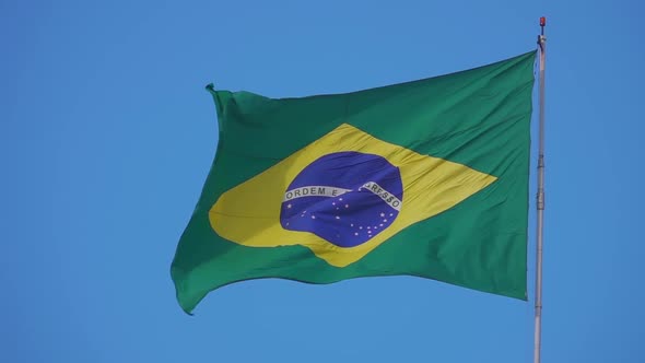 National Flag of Brazil Waving Against Clear Blue Sky
