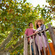 Couple relax on wood steps. - PhotoDune Item for Sale