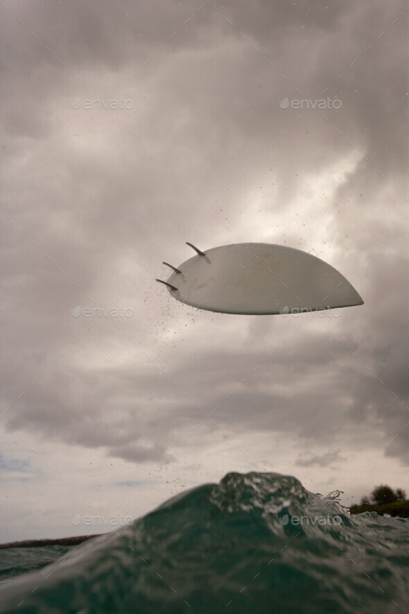 Surfboard in the air - Stock Photo - Images