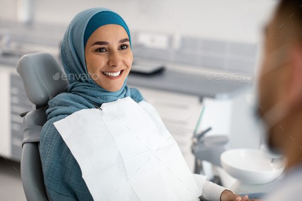 Smiling Muslim Lady In Hijab Having Check Up In Modern Dental Clinic ...