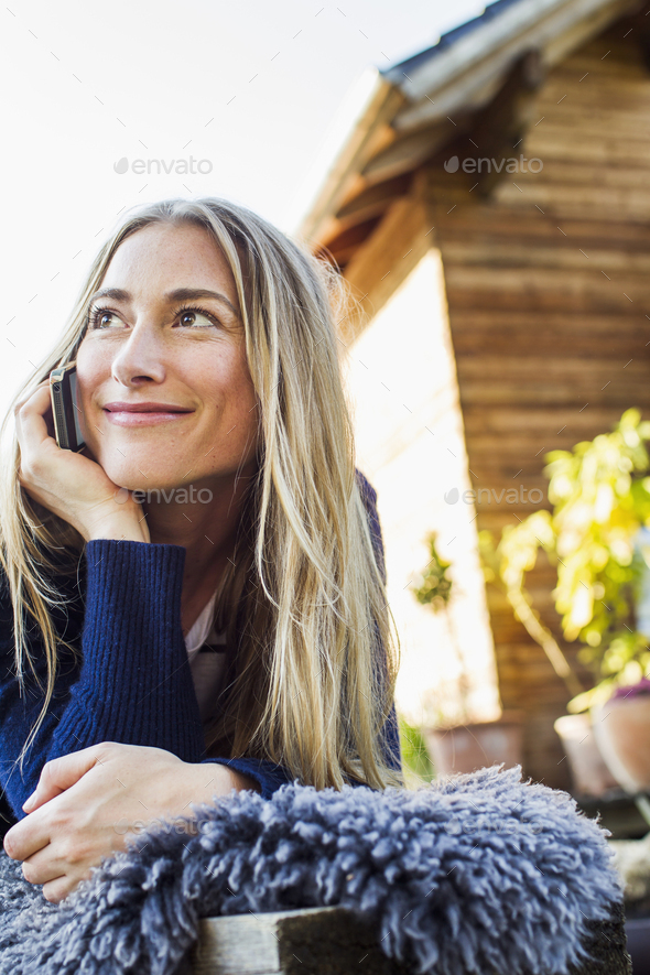 Mid adult woman on smartphone - Stock Photo - Images