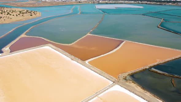 Aerial View Of Colorful Minerals At Salt Pan In Portugal. alt
