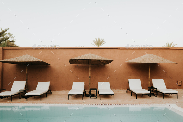 Sun loungers by hotel pool, Douba, Morocco
