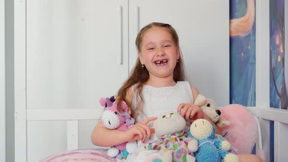 Little girl change teeth smile looking at camera at home. Portrait attractive cheerful young child alt