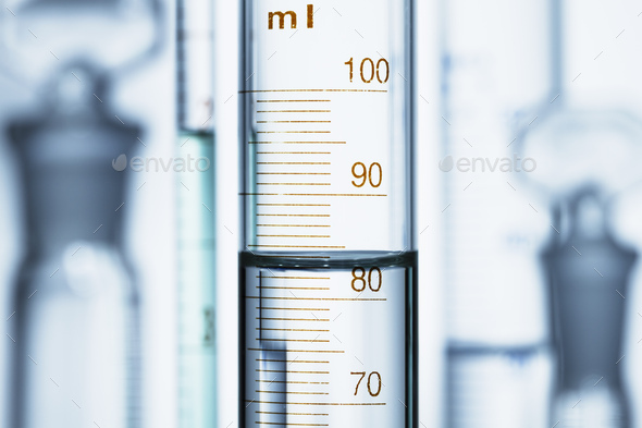 Meniscus. Curved surface (meniscus) of water in graduated cylinder. Liquid volume measured by
