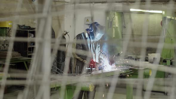 Steel armature standing near welder