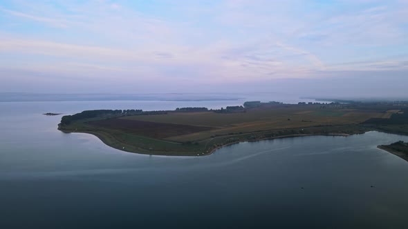 Aerial drone view of the Duruitoarea natural reservation in Moldova. River and fog in the air, field alt