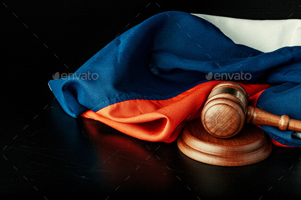 Russian justice. Wooden gavel and russian flag