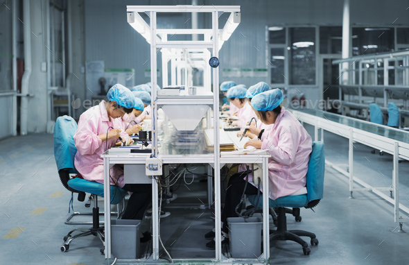 Female workers in solar panel assembly factory, Solar Valley, Dezhou, China