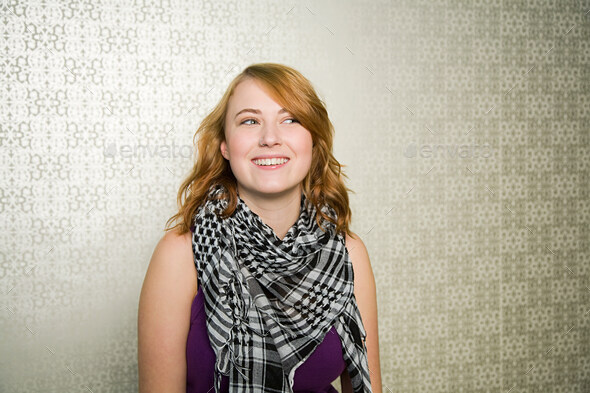 Portrait of teenage girl wearing checked scarf
