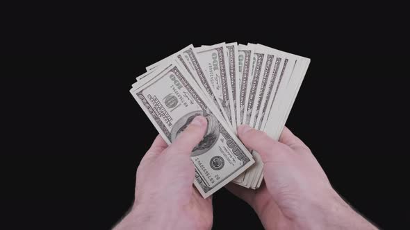 Male Hands Counting Lot of 100 American Dollar Banknotes Fan with Alpha Channel alt