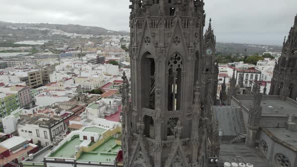 Close up of Neo-gothic style bell tower of Arucas Church in Canary Islands, Spain. Orbiting shot alt