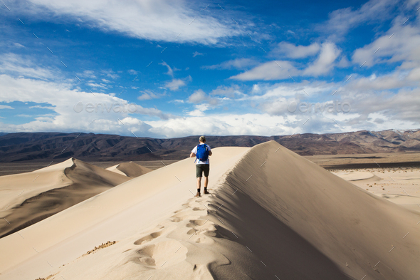Trekker walking in Death Valley National Park, California, US