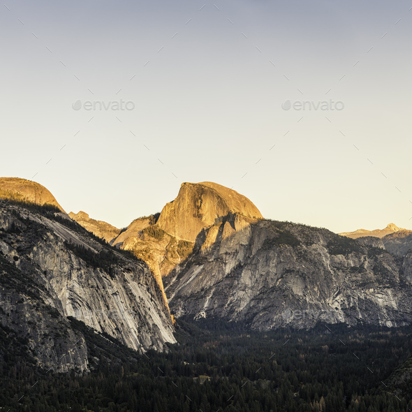 Elevated view of valley forest and mountains at sunset, Yosemite National Park, California, USA