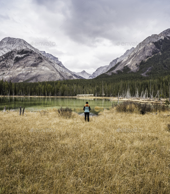 Woman standing, looking at view, rear view, Kananaskis Country; Bow Valley Provincial Park,