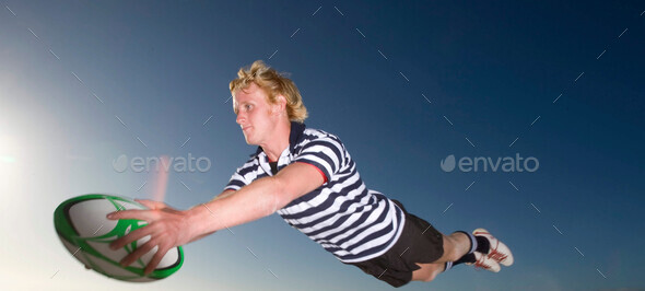 Rugby Player scoring a try