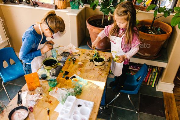 Two girls doing science experiments at messy table Stock Photo by Image ...