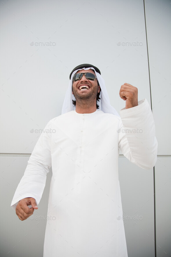 Middle eastern man punching the air