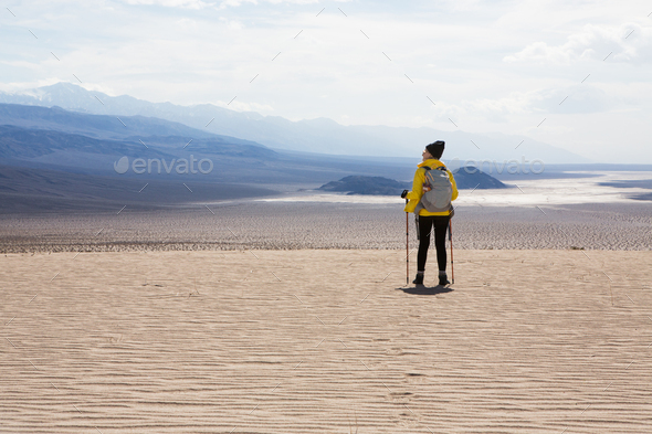 Trekker taking in sights, Death Valley National Park, California, US