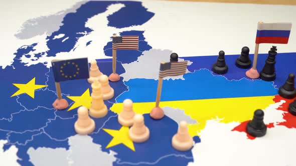 EU USA and Russian Flags with Chess Pieces Symbolizing the Conflict and Control of Ukraine alt
