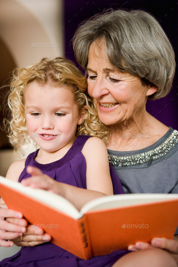 grandchild and grandma reading book