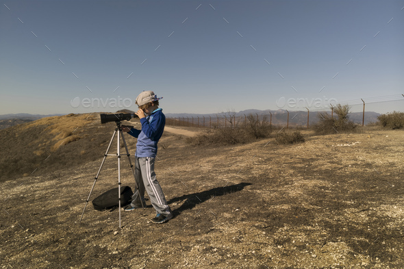 Hiking with telescope - Stock Photo - Images