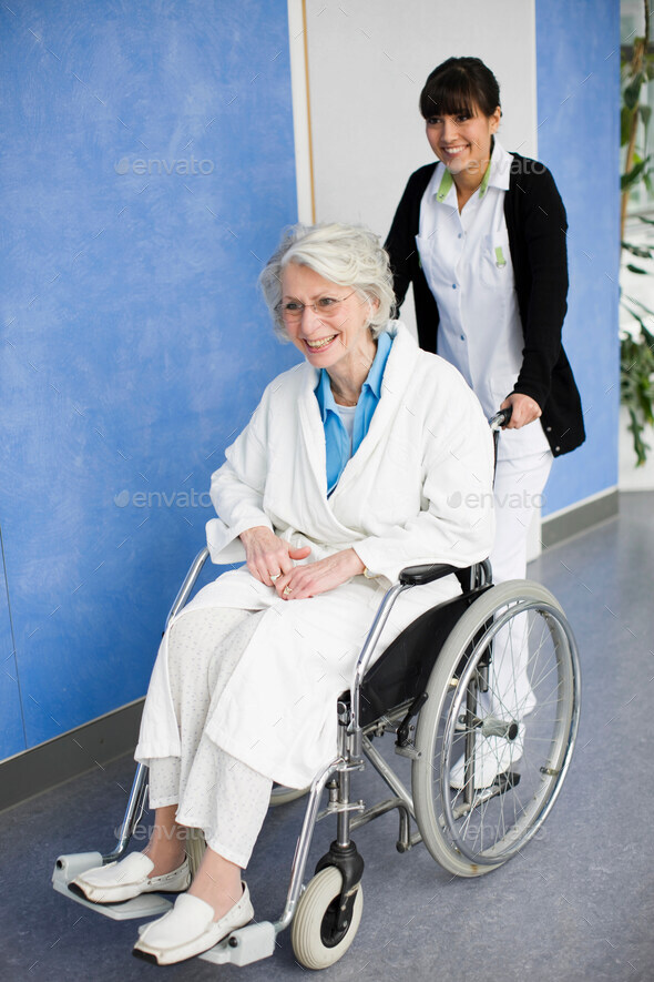 Old woman in a wheel chair and nurse