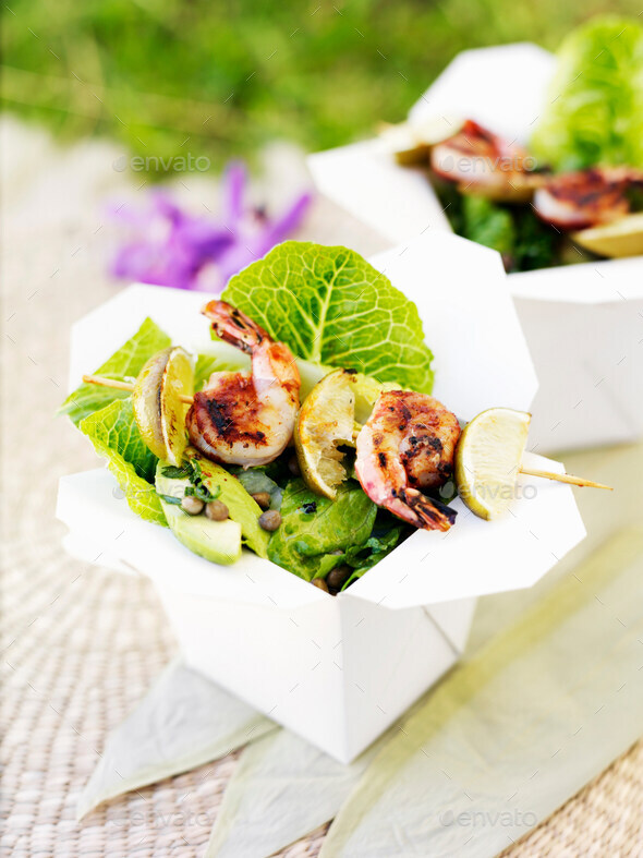 Prawns with salad in takeout boxes - Stock Photo - Images