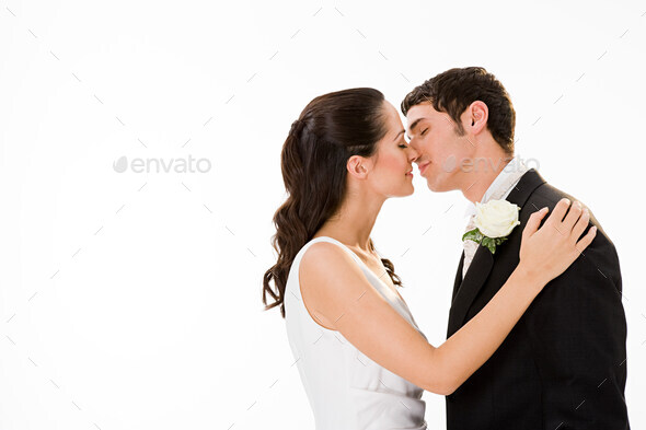 Newlywed couple kissing - Stock Photo - Images