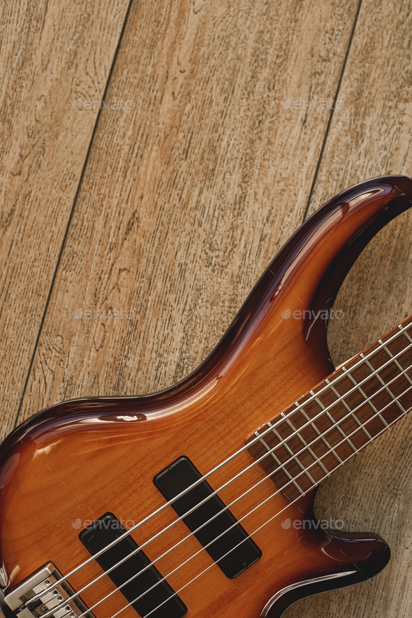 Get to know your instrument. Close up view of the electric guitar body with metal strings against of