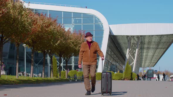 Senior Grandfather Tourist Go to International Airport Terminal for Boarding on Plane for Traveling alt