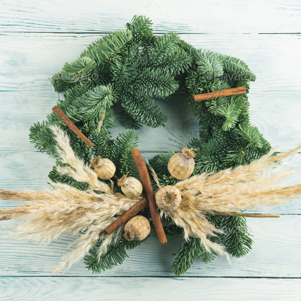 Christmas natural spruce wreath with dry decor, pampas reed
